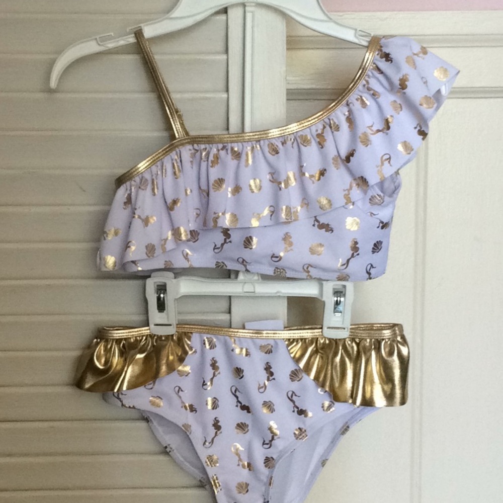 Nicole Miller suit.